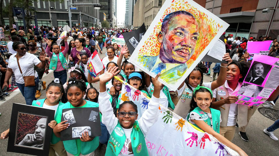 Girl Scouts march together during the 45th Annual Original MLK Day Parade downtown on Monday, Jan. 16, 2023 in Houston.