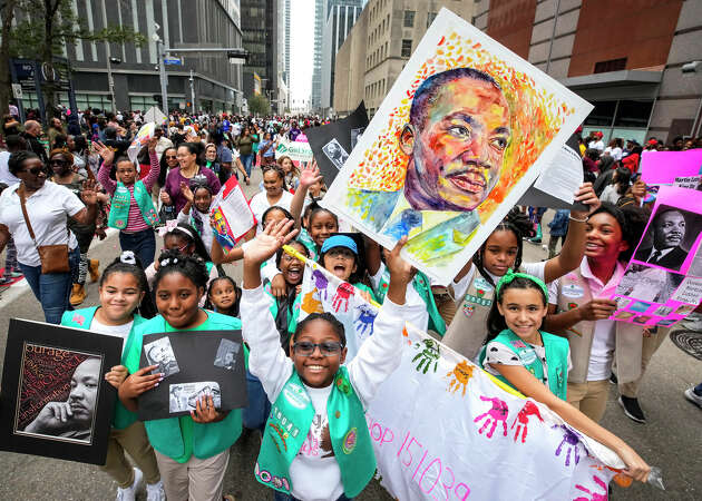 Girl Scouts march together during the 45th Annual Original MLK Day Parade downtown on Monday, Jan. 16, 2023 in Houston.