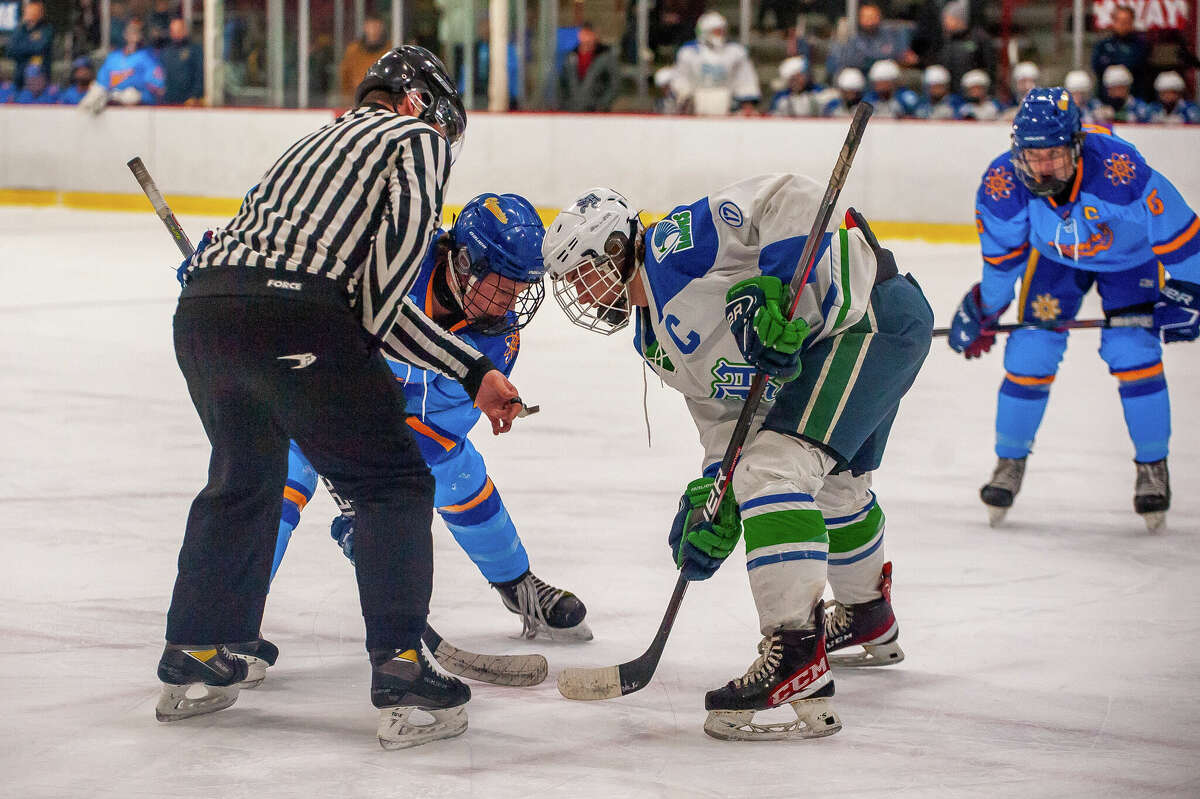 Midland and Saginaw Heritage high hockey players square off in a game on Feb. 1, 2023 at the Midland Civic Arena.