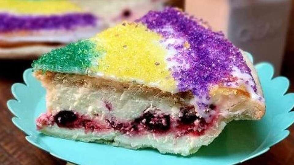 Proud Pie's interpretation of a king cake is a cheesecake in a pie crust topped with traditional king cake frosting.