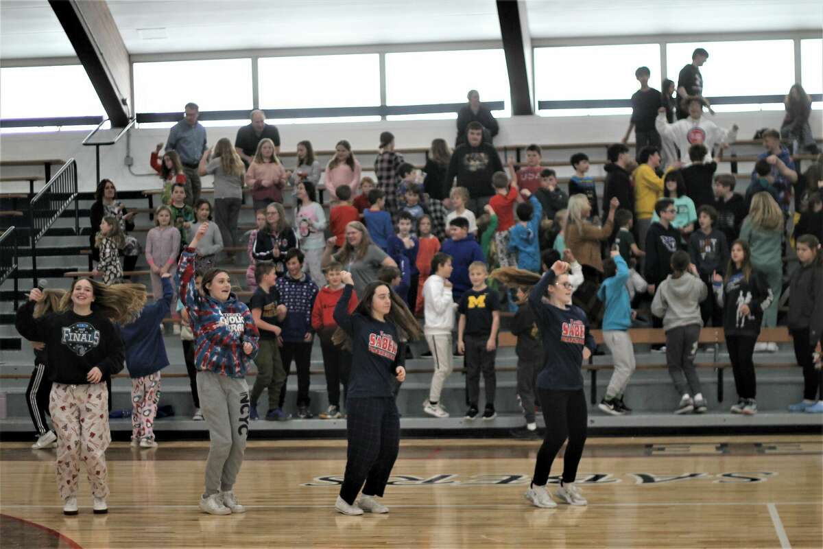 Manistee Catholic Central students dance to "Cotton Eye Joe" Jan. 31 between powderpuff volleyball games as part of the school's Catholic Schools Week festivities.