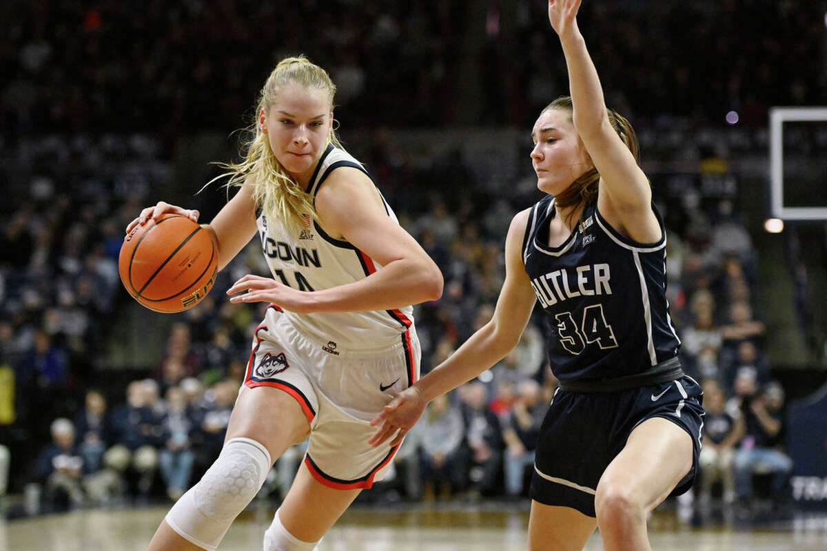 UConn's Dorka Juhasz (14) is guarded by Butler's Anna Mortag (34) in the first half of an NCAA college basketball game, Saturday, Jan. 21, 2023, in Storrs, Conn. (AP Photo/Jessica Hill)