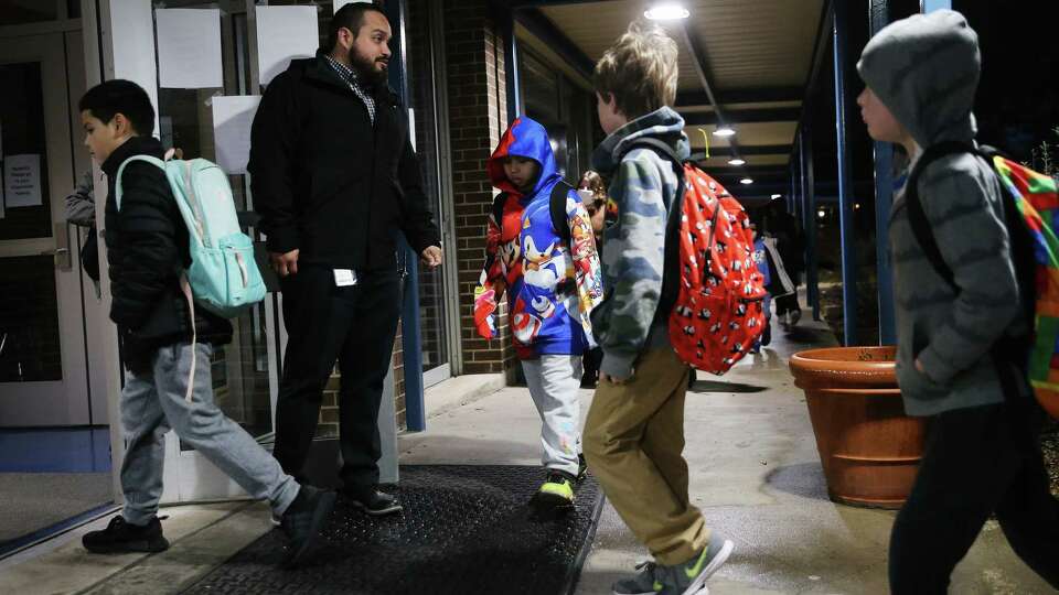 Howsman Elementary students arrive to school in the early hours of Thursday, Feb. 2, 2023. NISD had closed schools for the past two days due to the icy weather conditions but re-opened by Thursday morning.