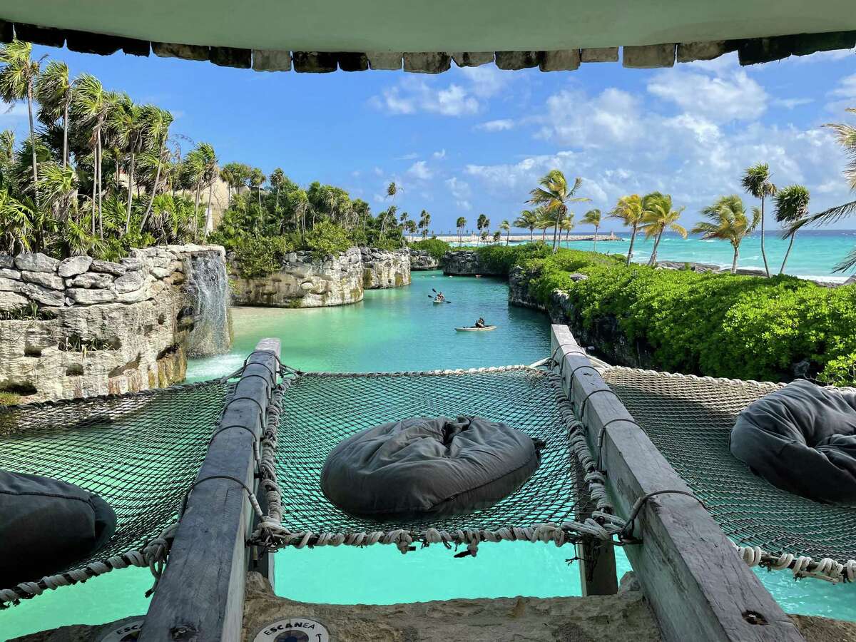 At the all-inclusive Hotel Xcaret Arte, guests can perch above the river and watch the boat traffic or explore the river by kayak or stand-up paddleboard.
