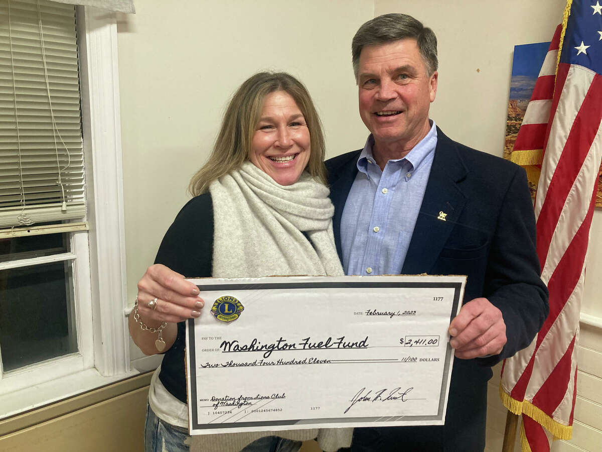 Jen Pote, community services director for the town of Washington, accepted a $2,411 check from Lions Club President John Quist. The money, raised by the Washington Fire Department and the Washington Lions, was donated to the town’s Fuel Fund. 