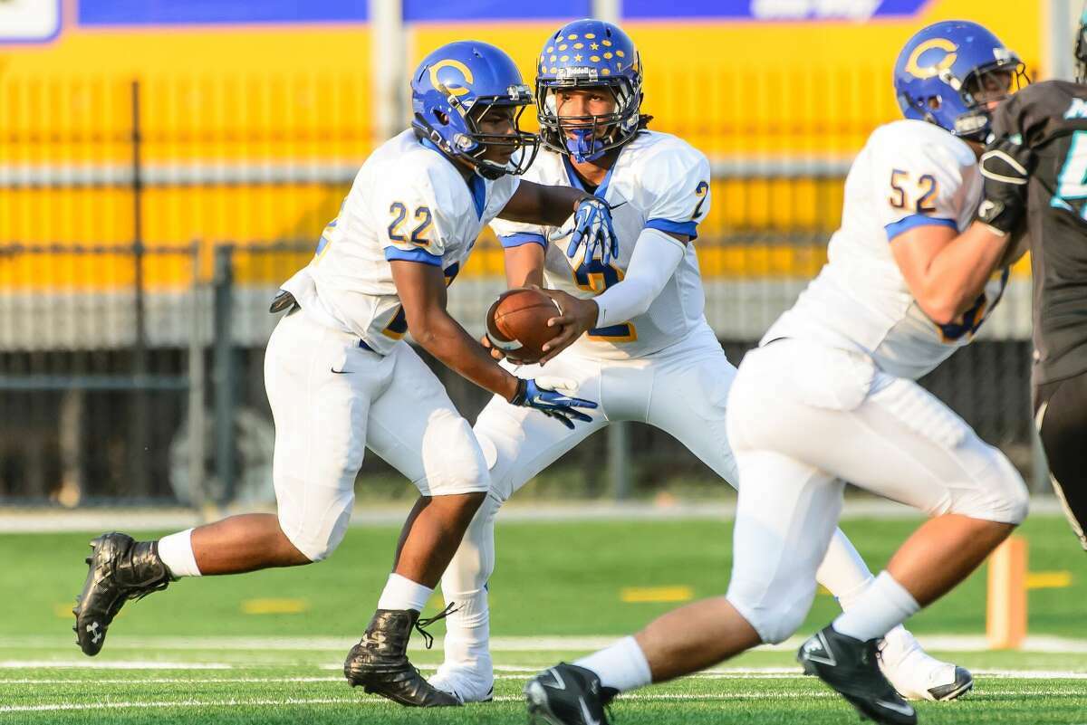 Channelview Jalen Hurts (2)  hands off the ball to Chris Jefferson (22) during a high school game on Sept. 4, 2013.