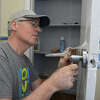 Volunteer Tim McKeon, of Ridgefield, works with other volunteers on an Ability Beyond group home that is the first-ever collaboration between non-profits Housatonic Habitat for Humanity and Ability Beyond. They are renovating/upgrading an Ability Beyond group home in Danbury, Conn. Thursday, February 2, 2023.