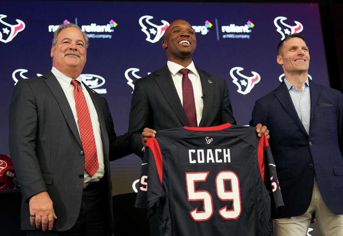 Chair and CEO Cal McNair, new head coach DeMeco Ryans, and general manager Nick Caserio take a photo after Ryans was introduced as the new head coach of the Texans at NRG Stadium on Thursday, Feb. 2, 2023 in Houston.