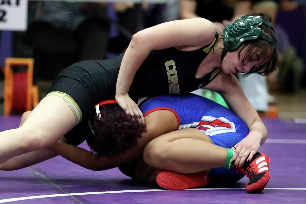 Veronica Tuico of Conroe competes against Solace Gonzalez of Oak Ridge in a girls 120-pound bout during the District 8-6A Wrestling Championships at Lynn Lucas Middle School, Thursday, Feb. 2, 2023, in Willis.