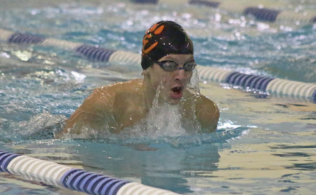 Ridge Batchelor takes second in the 100-yard breaststroke in 1:13.56 against O'Fallon on Thursday inside the Chuck Fruit Aquatic Center.