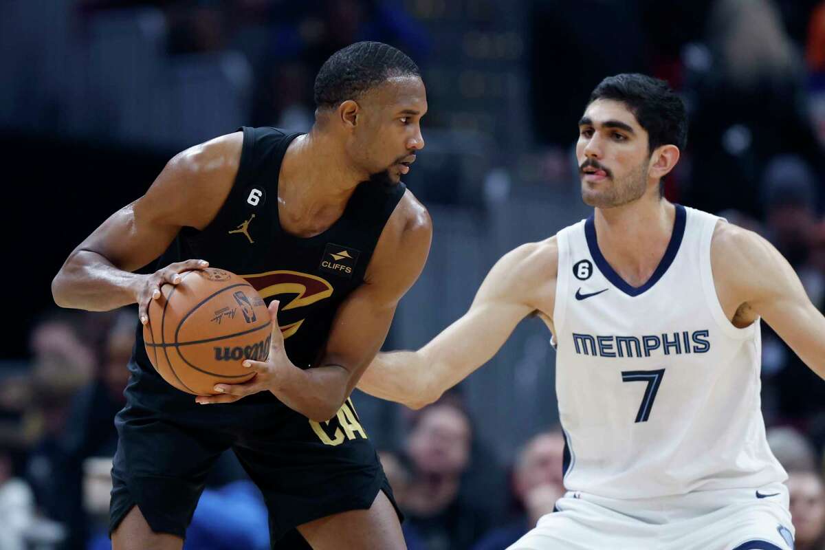 Cleveland Cavaliers forward Evan Mobley plays against Memphis Grizzlies forward Santi Aldama (7) during the first half of an NBA basketball game, Thursday, Feb. 2, 2023, in Cleveland.