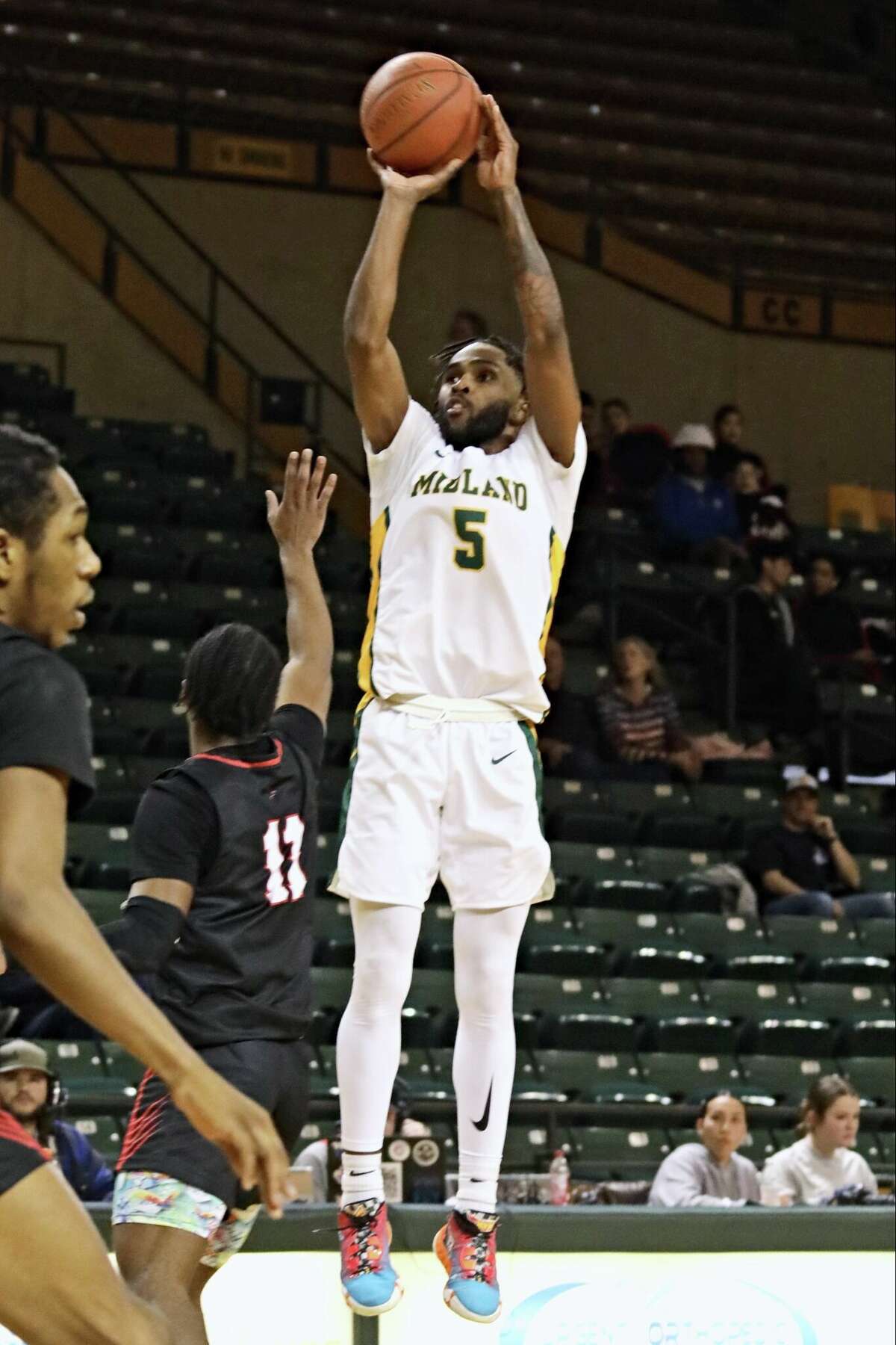 Midland College's Doug Young shoots for two of his game-high 28 points against Howard College Thursday night at Chaparral Center.