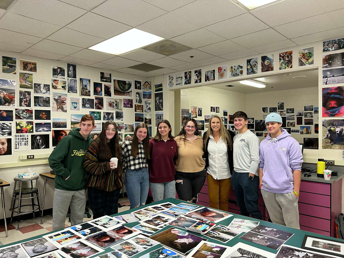 Amity High School photography students have salvaged more than 100 photos of Hurricane Ian victims using skills they learned from their teacher, Lisa Toto.