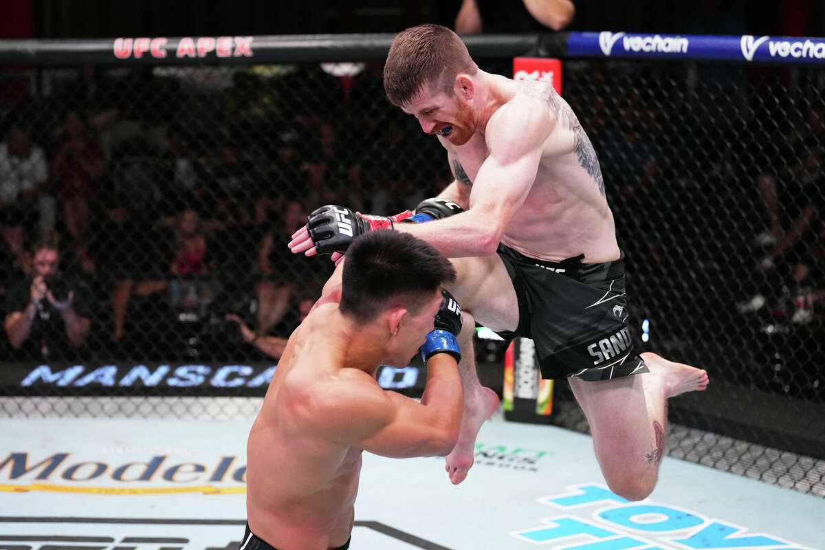 Cory Sandhagen, right, attempts a flying knee towards Song Yadong of China in a bantamweight fight during the UFC Fight Night event at UFC APEX on September 17, 2022 in Las Vegas, Nevada.
