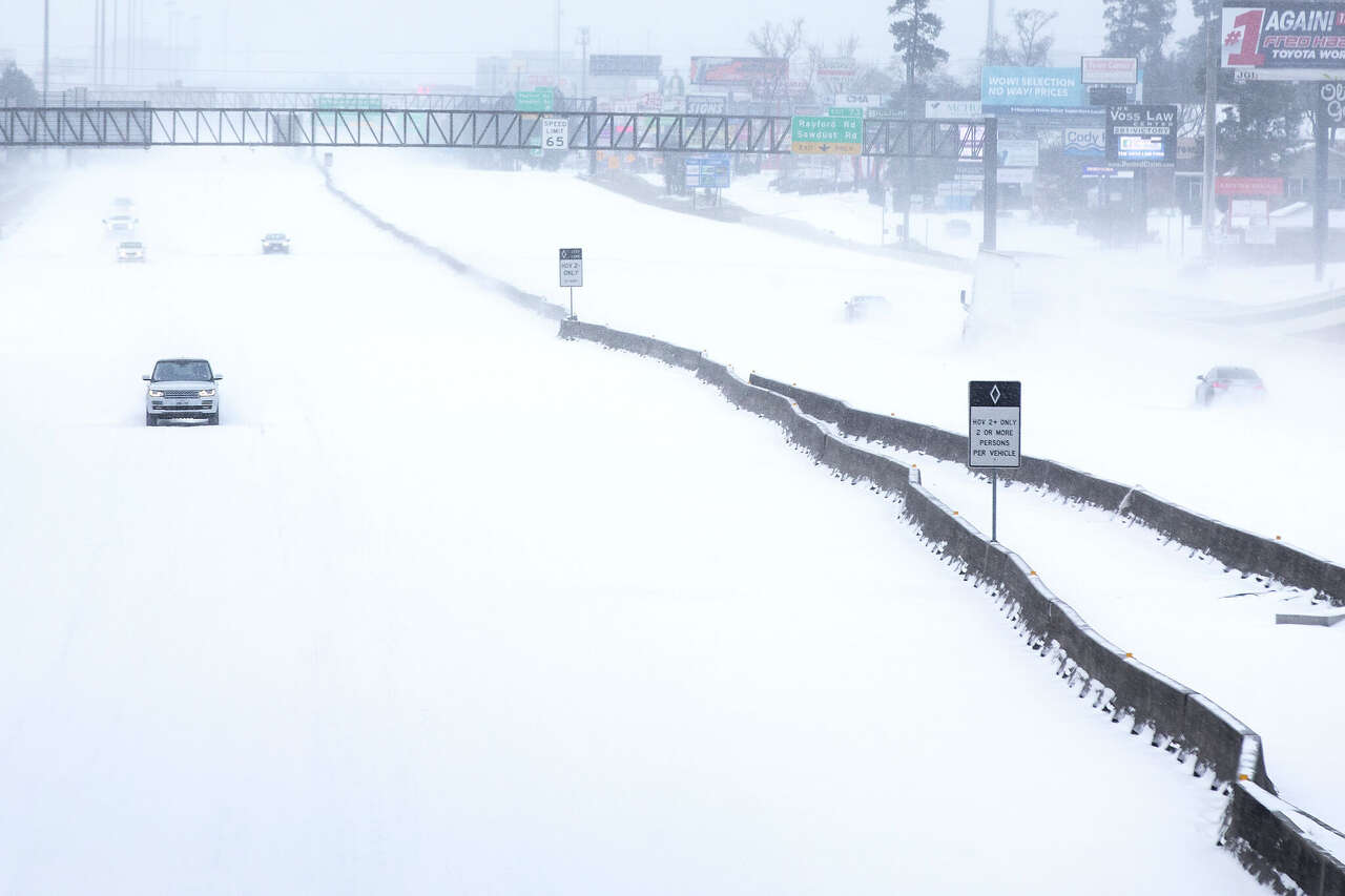 Traffic is sparse on the snow-covered I-45 near The Woodlands Parkway following an overnight snowfall Monday, Feb. 15, 2021 in The Woodlands. Temperatures plunged into the teens Monday with light snow and freezing rain.