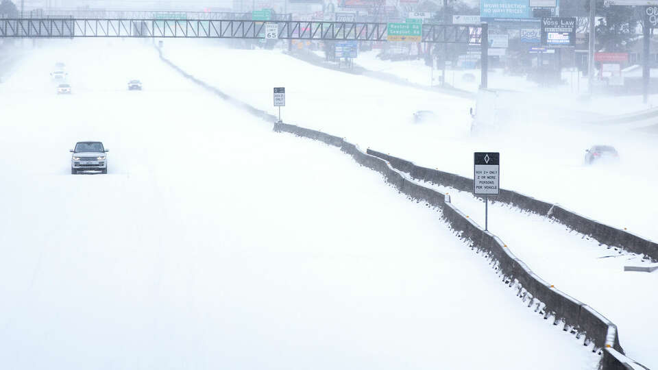 Traffic is sparse on the snow-covered I-45 near The Woodlands Parkway following an overnight snowfall Monday, Feb. 15, 2021 in The Woodlands. Temperatures plunged into the teens Monday with light snow and freezing rain.