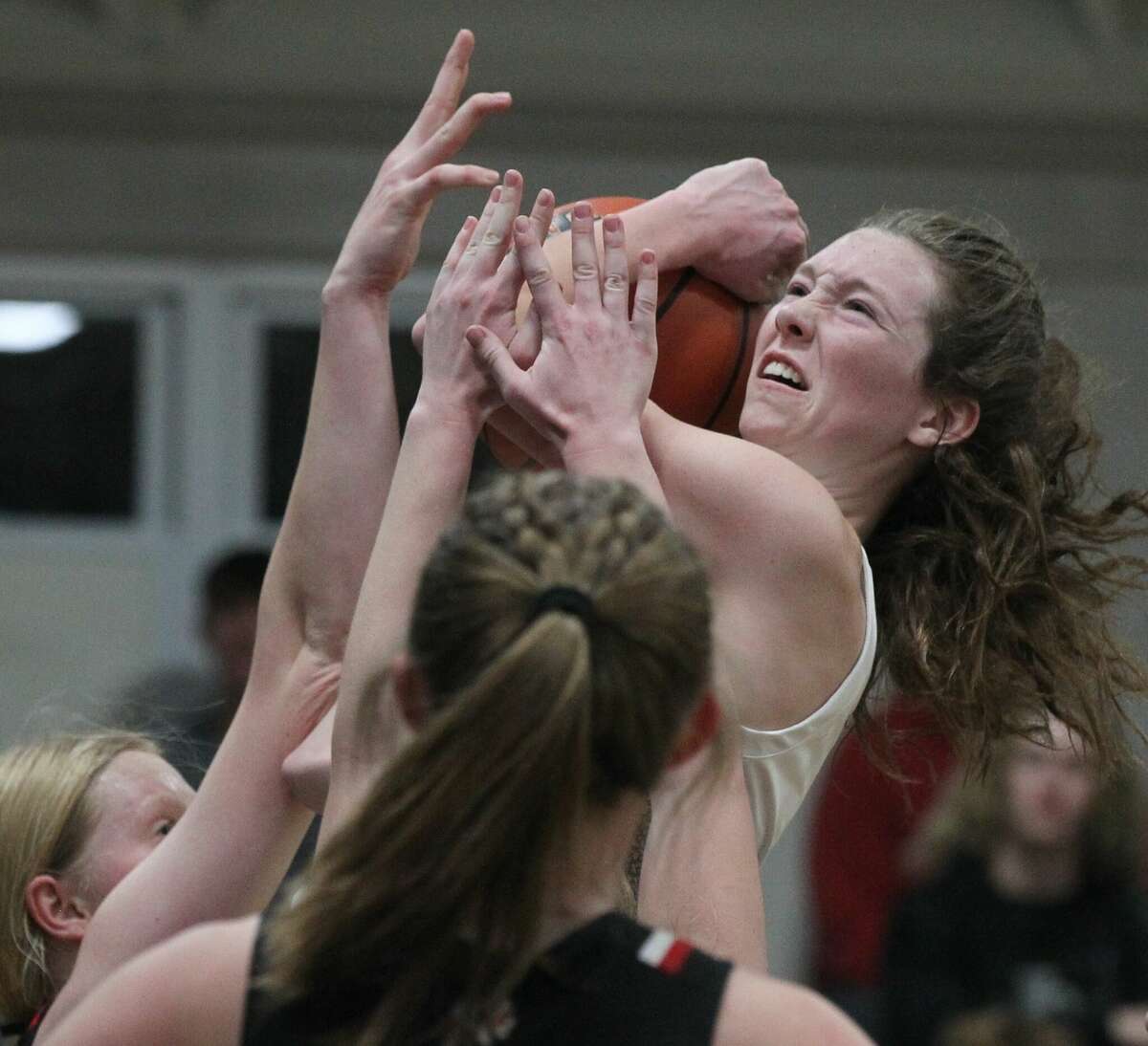 West Central's Bryleigh Fox is fouled as she drives to the basket during a girls' basketball game against Calhoun at Winchester Thursday night.