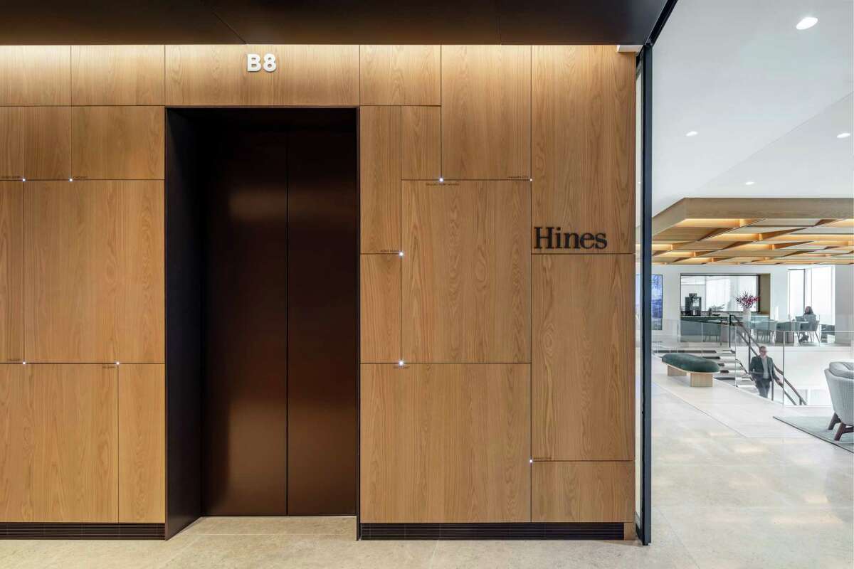 Wood paneling on the stairwells and at elevators is a nod to the paneling the firm had in its former Williams Tower offices.