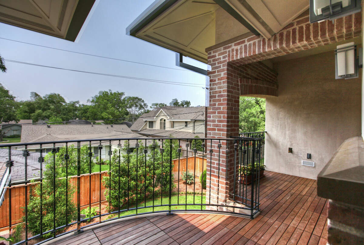 The primary bedroom has a balcony attached 