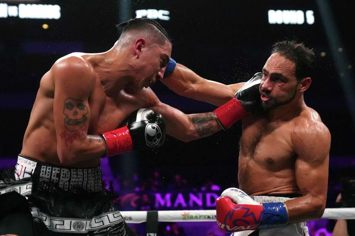 LAS VEGAS, NEVADA - FEBRUARY 05: Mario Barrios (R) and Keith Thurman trade blows during a welterweight bout at Michelob ULTRA Arena on February 05, 2022 in Las Vegas, Nevada. Thurman won by unanimous decision. (Photo by Joe Buglewicz/Getty Images)