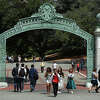 FILE - In this May 10, 2018, file photo, students walk past Sather Gate on the University of California at Berkeley campus in Berkeley, Calif. (AP Photo/Ben Margot, File)