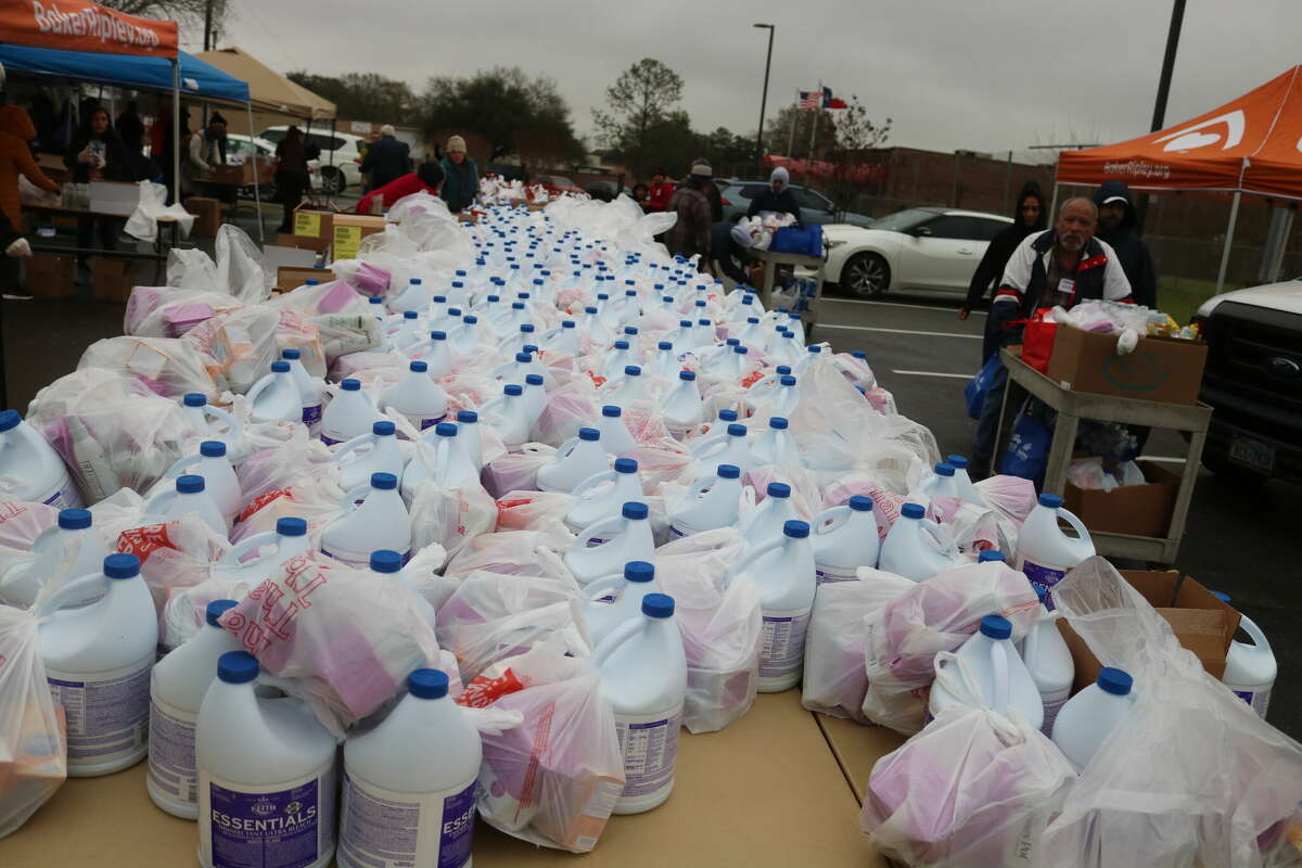 Containers of bleach fill tables during Thursday's disaster relief fair for victims of the Jan. 24 tornado that went through Pasadena, Deer Park and Baytown.