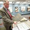Tom Ruller, the New York state archivist, displays a portion of an official ledger on Tuesday, Jan. 31, 2023, that shows the state had given some 3,000 properties in the Adirondack Park to former slaves. The records are kept in the New York State Museum in Albany, NY.