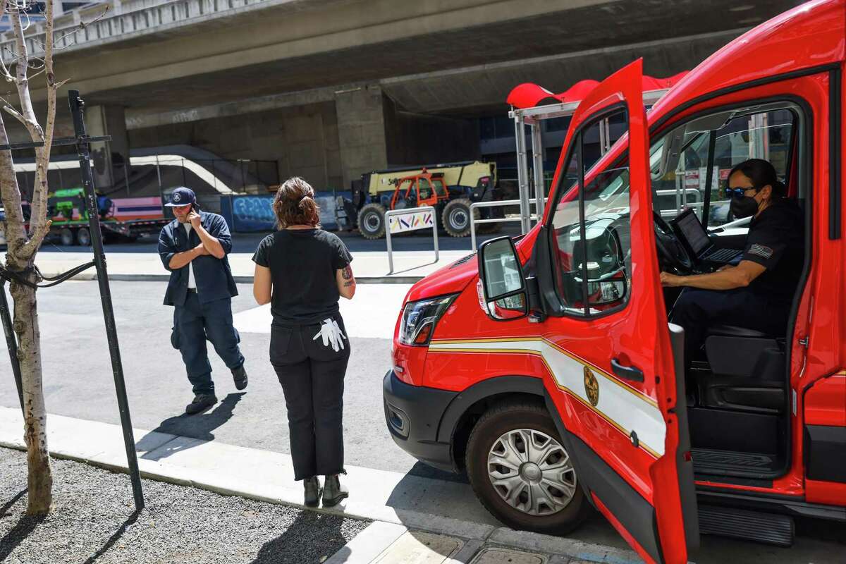 SF homelessness: How Mayor Breed's street crisis teams are working. SFFD Captain Patrick Renshaw (left) makes a phone call to try and get a bed for a woman living on the street in San Francisco, California on Thursday, Aug. 25, 2022.