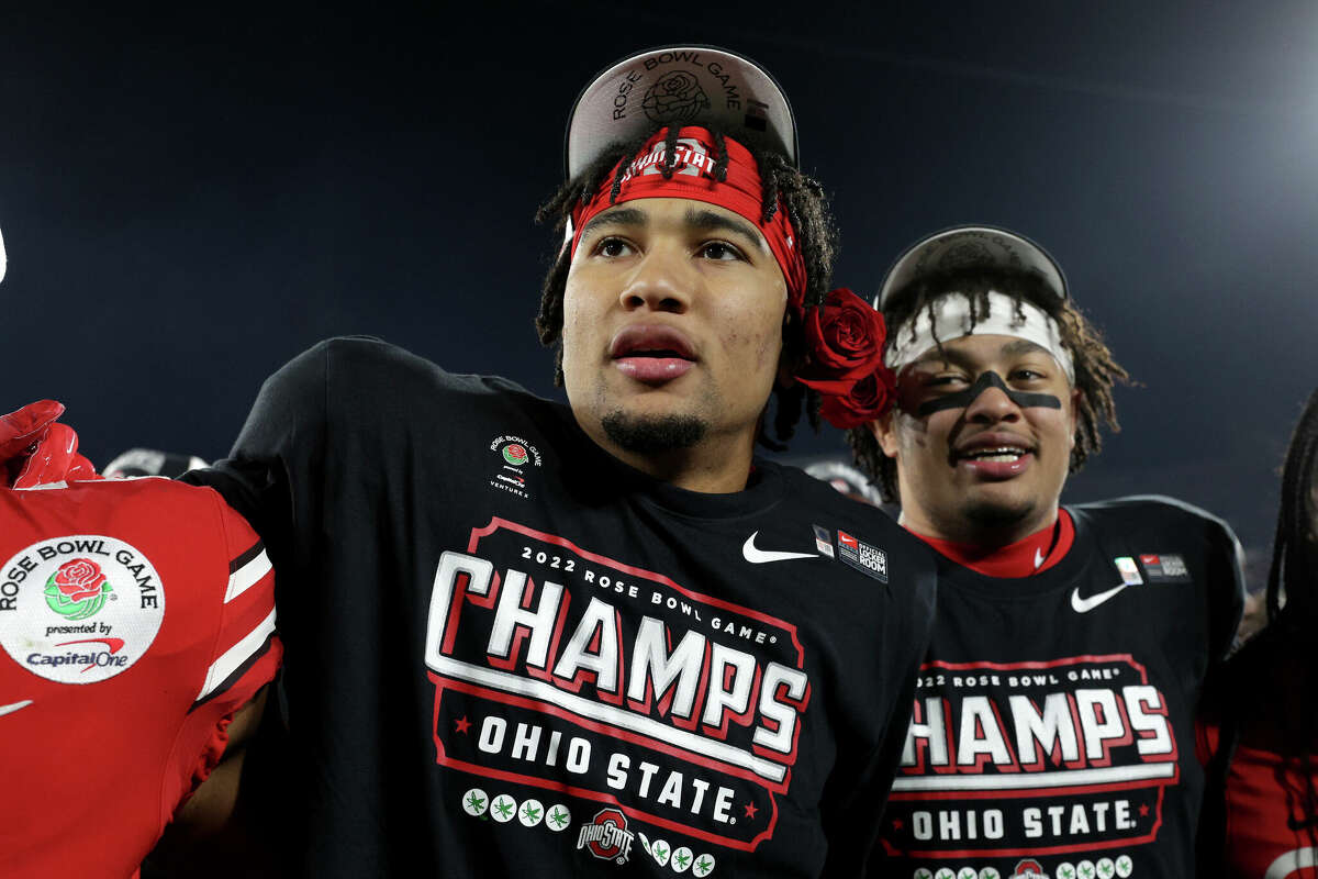 C.J. Stroud #7 of the Ohio State Buckeyes and Jaxon Smith-Njigba #11 of the Ohio State Buckeyes celebrate after defeating the Utah Utes 48-45 in the Rose Bowl Game at Rose Bowl Stadium on January 01, 2022 in Pasadena, California.