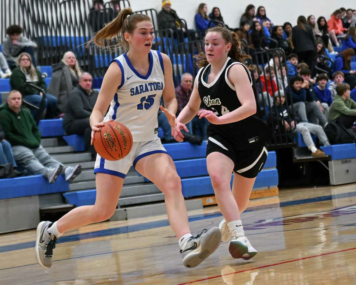 Saratoga junior Carly Wise drives to the basket in front of Shenendehowa defender Gabby Stuart on Friday, Feb. 3, 2023, at Saratoga High School in Saratoga, NY.