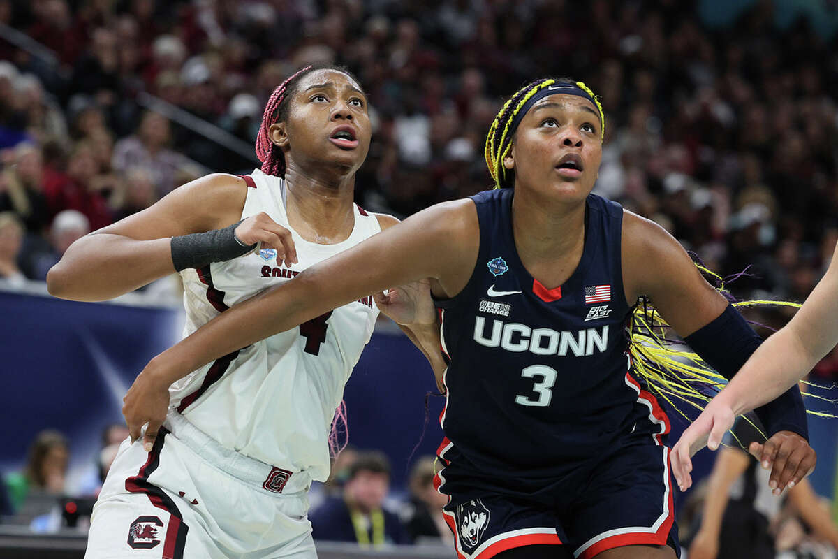 MINNEAPOLIS, MINNESOTA - APRIL 03: Aliyah Boston #4 of the South Carolina Gamecocks and Aaliyah Edwards #3 of the UConn Huskies battle for position in the first half during the 2022 NCAA Women's Basketball Tournament National Championship game at Target Center on April 03, 2022 in Minneapolis, Minnesota. (Photo by Andy Lyons/Getty Images)