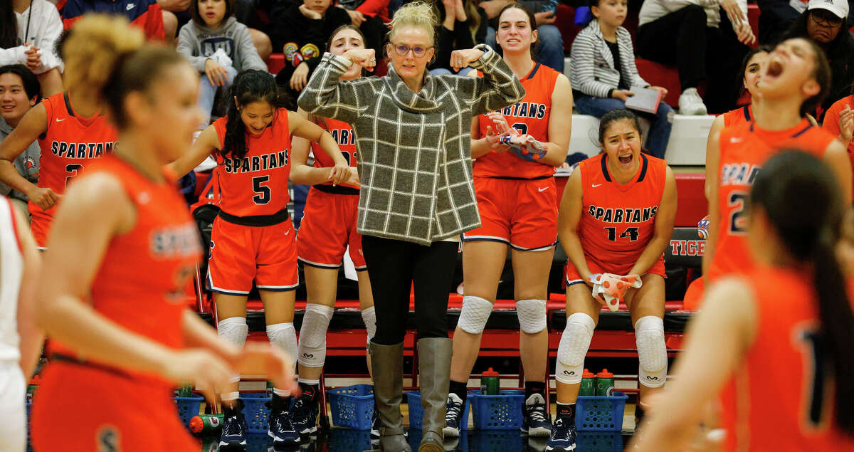 Seven Lakes Spartans head coach Angela Spurlock celebrates in the fourth quarter during the high school basketball game between the Seven Lakes Spartans and the Katy Tigers at Katy High School in Katy, TX on Friday, February 3, 2023. The Seven Lakes Spartans defeated the Katy Tigers.