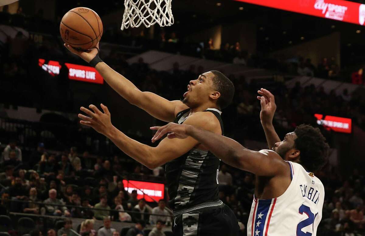 Spurs’ Keldon Johnson (03) goes for a shot against Philadelphia 76ers’ Joel Embiid (21) during their game at the AT&T Center on Friday, Feb. 3, 2023.