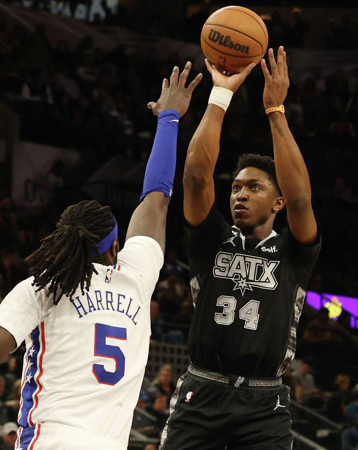 Spurs’ Stanley Johnson (34) attempts a shot over Philadelphia 76ers’ Montrezl Harrell (05) during their game at the AT&T Center on Friday, Feb. 3, 2023.