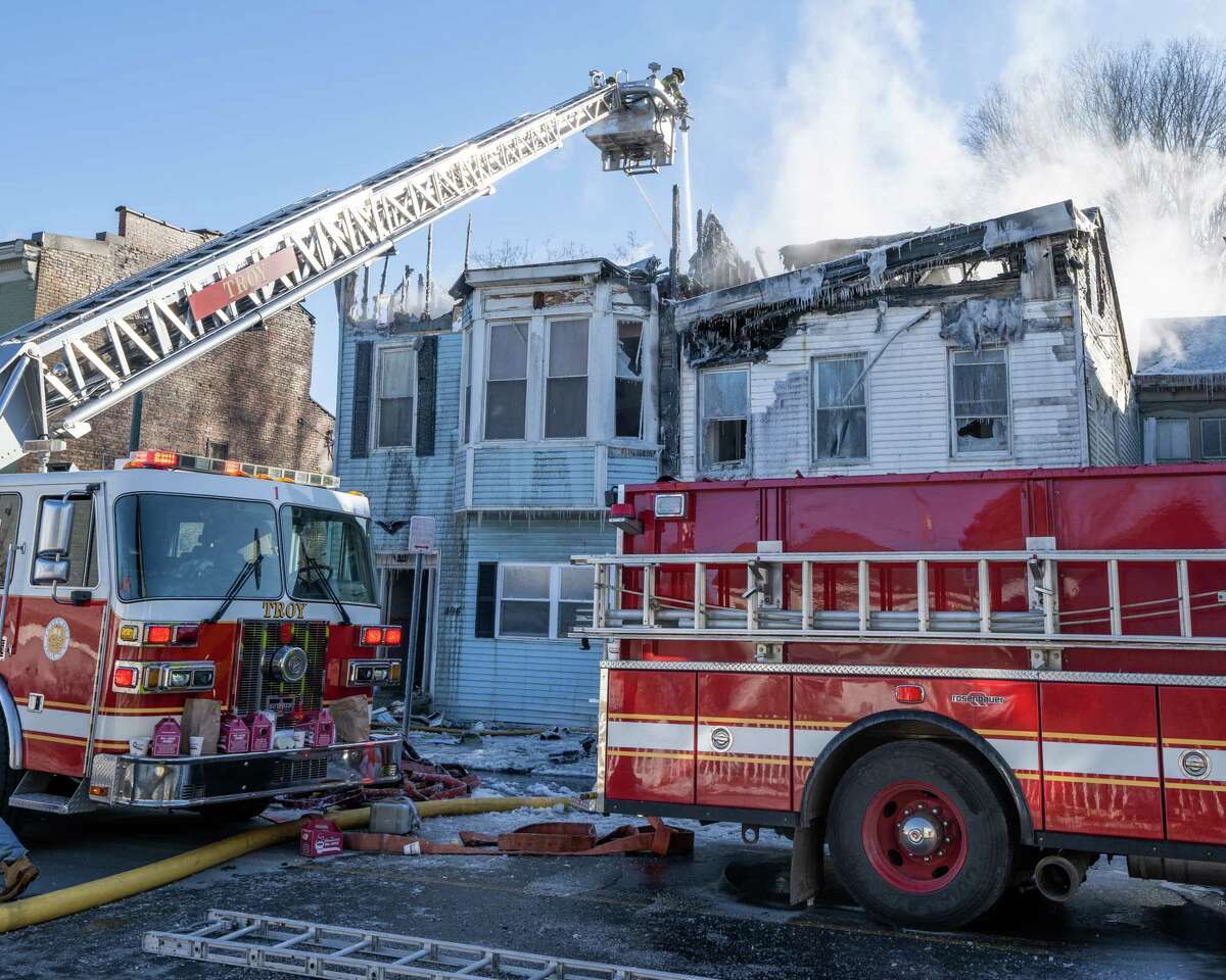 Firefighters battle a blaze in below zero temperatures at 494 Second Ave. on Saturday, Feb. 4, 2023, in Troy, NY.