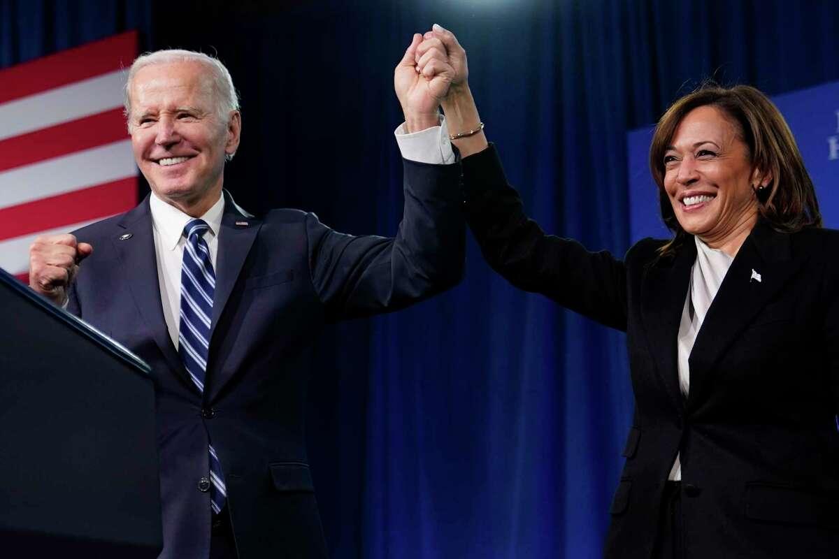 President Joe Biden and Vice President Kamala Harris stand on stage at the Democratic National Committee winter meeting, Friday, Feb. 3, 2023, in Philadelphia.