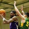 UAlbany’s Gerald Drumgoole Jr. passes the ball under pressure from Vermont’s Robin Duncan during a game at McDonough Sports Complex in Troy, N.Y. on Saturday, Feb. 4, 2023. (Jenn March, Special to the Times Union)