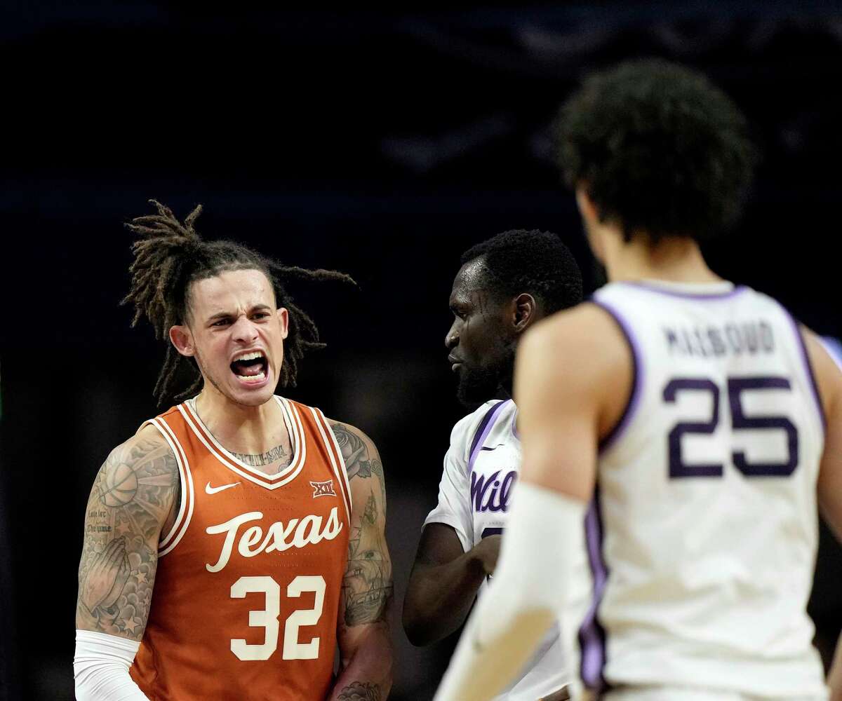 Texas forward Christian Bishop (32) celebrates after making a basket during the second half of an NCAA college basketball game against Kansas State Saturday, Feb. 4, 2023, in Manhattan, Kan. Texas won 69-66. (AP Photo/Charlie Riedel)