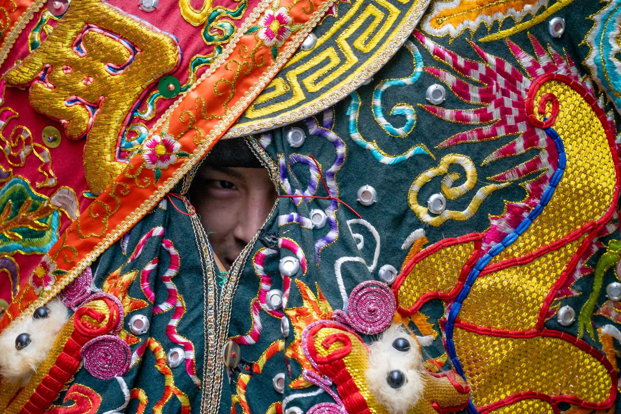 The Year of the Rabbit begins with a colorful parade winding through a wet S.F.