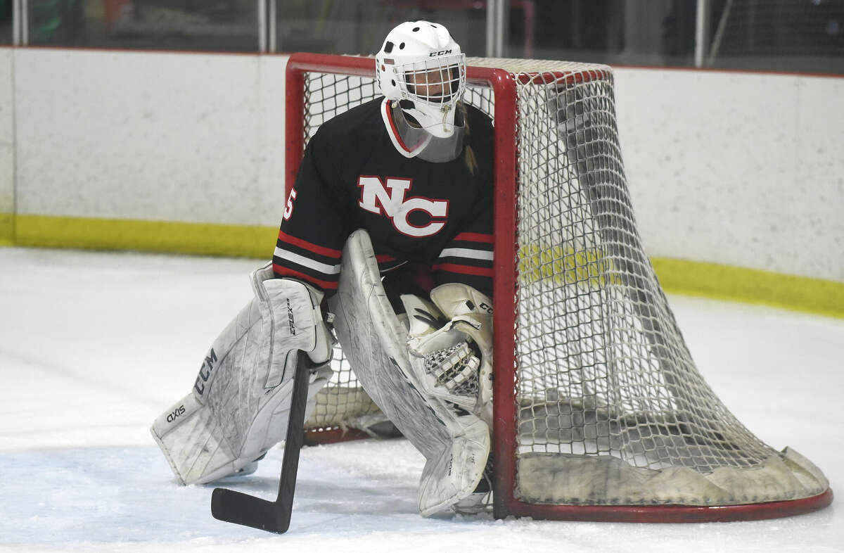 New Canaan goalie Ashton Pinkernell guards the net during a girls ice hockey game against Darien at the Darien Ice House on Saturday, Feb. 4, 2023.