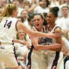 UConn's Dorka Juhasz, left, Nika Muhl, center, and Aubrey Griffin, right, celebrate after scoring in the NCAA women's basketball game between No. 5 UConn and No. 1 South Carolina at the XL Center in Hartford, Conn. Sunday, Feb. 5, 2023.