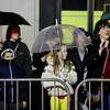 Folks observe the annual Chinese New Year Festival and Parade on Saturday in San Francisco. The city saw a quarter-inch of rain Saturday, bringing the total amount of precipitation during the current rainfall season — which runs from July 1 to June 30 — up to 22.89 inches as of 2 p.m., according to meteorologists.