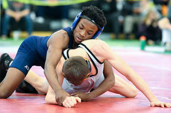 Trumbull, New Milford, Xavier claim wrestling tournament titles