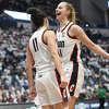 UConn's Lou Lopez Senechal, left, and Dorka Juhasz celebrate in No. 1 South Carolina's 81-77 win over No. 5 UConn in the NCAA women's basketball game at the XL Center in Hartford, Conn. Sunday, Feb. 5, 2023.