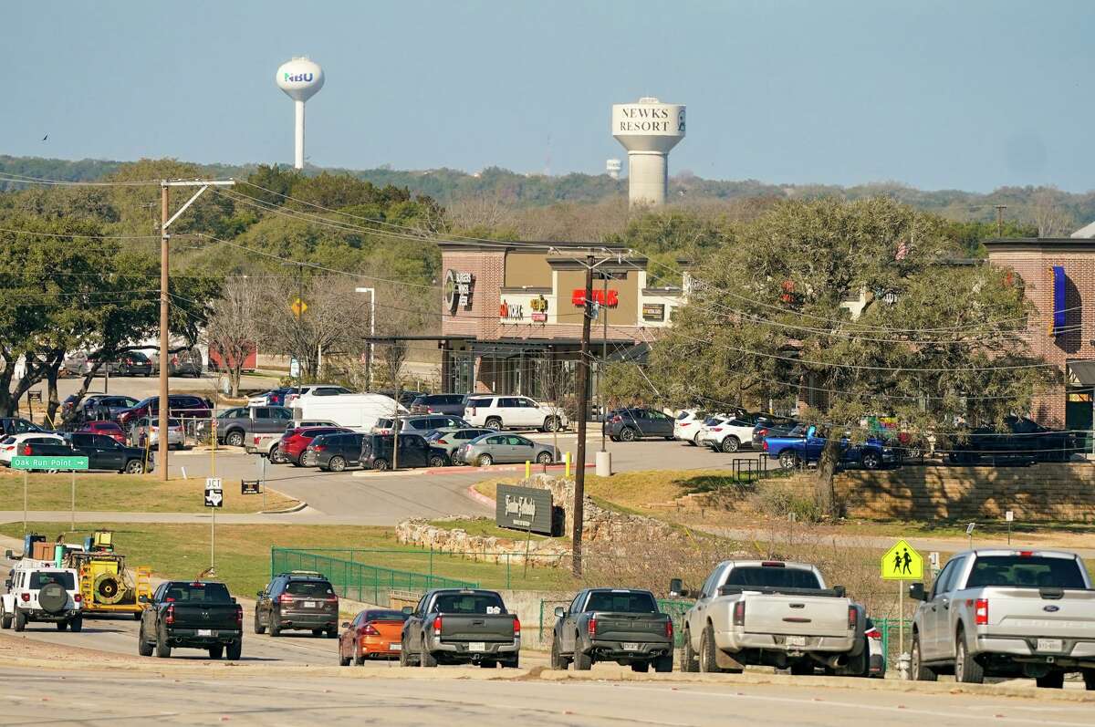 Cars travel along Highway 46 in front of retail development in New Braunfels. The city of New Braunfels has projected that developable land will run out by 2035.