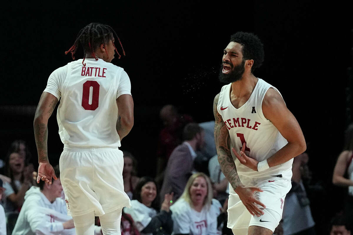 PHILADELPHIA, PA - FEBRUARY 05: Khalif Battle #0 of the Temple Owls celebrates with Damian Dunn #1 against the Houston Cougars in the first half at the Liacouras Center on February 5, 2023 in Philadelphia, Pennsylvania. (Photo by Mitchell Leff/Getty Images)