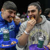 Jesse and Marvin eat wings together at Hudson Valley WingFest in Poughkeepsie, N.Y. on Feb. 4, 2023.