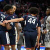 Connecticut guard Jordan Hawkins, second from the left, guard Tristen Newton (2) and guard Andre Jackson Jr. (44) react after an NCAA college basketball game next to Georgetown guard Jay Heath (5), Saturday, Feb. 4, 2023, in Washington. Connecticut won 68-62. (AP Photo/Nick Wass)