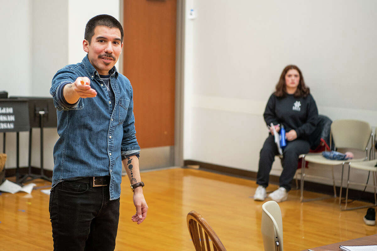 Playwright and guest director Jose Perez IV directs a scene of "Very Berry Dead," which will premiere at Saginaw Valley State University.