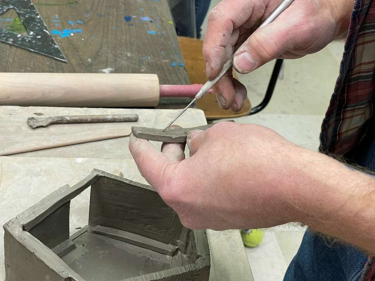 Joe Percy, Artworks' hand pottery instructor, taught a clay birdhouse workshop as part of the 2023 Festival of the Arts.